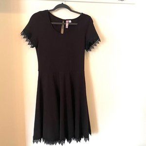 Short black dress with lace edges on sleeves and bottom of dress (Large)